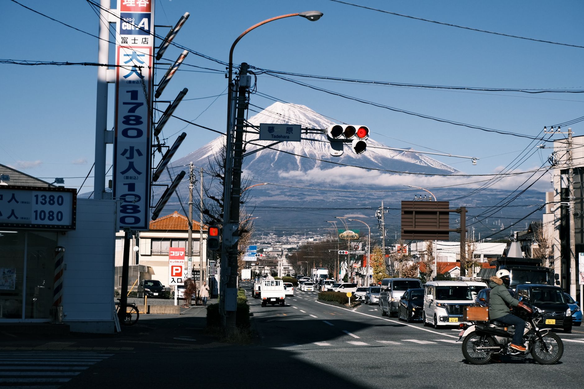 Scenic street view in Shizuoka showcasing Mount Fuji on a clear day.